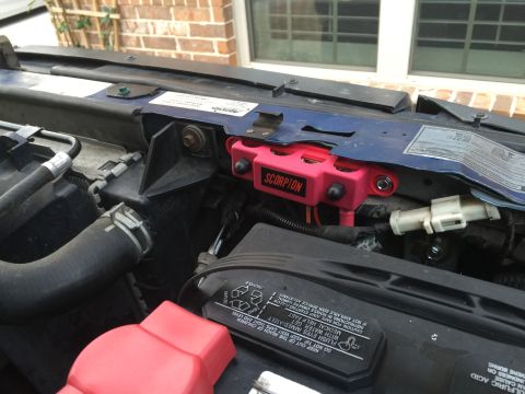 1996 Ford Bronco - Close-up view of engine bay components, including a Scorpion relay box and car battery.