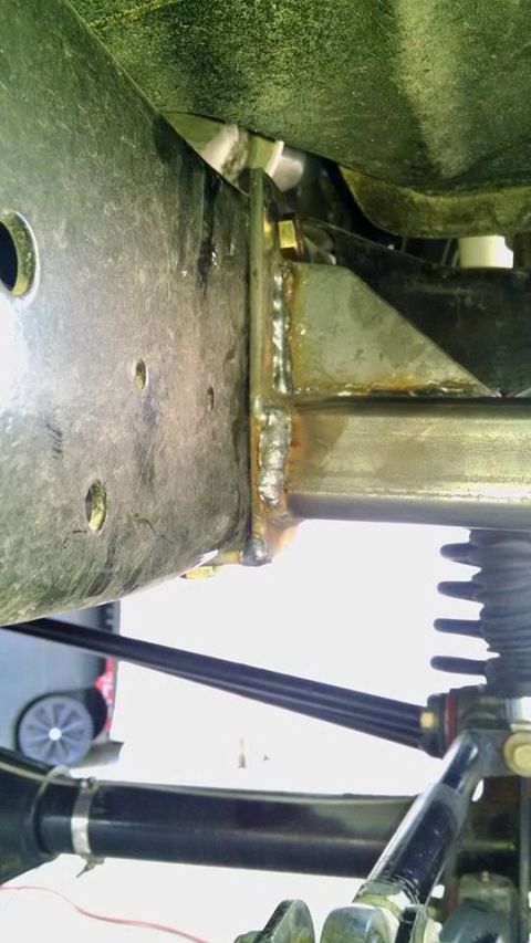 1979 Ford Bronco - Close-up view of a custom welded frame slider attachment on a vehicle's chassis.