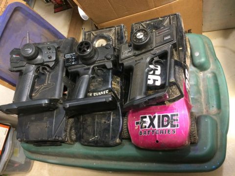 1989 Ford Bronco - Multiple remote control car bodies are visible, one with "Exide Batteries" branding and another with "TH RUNNER" text.