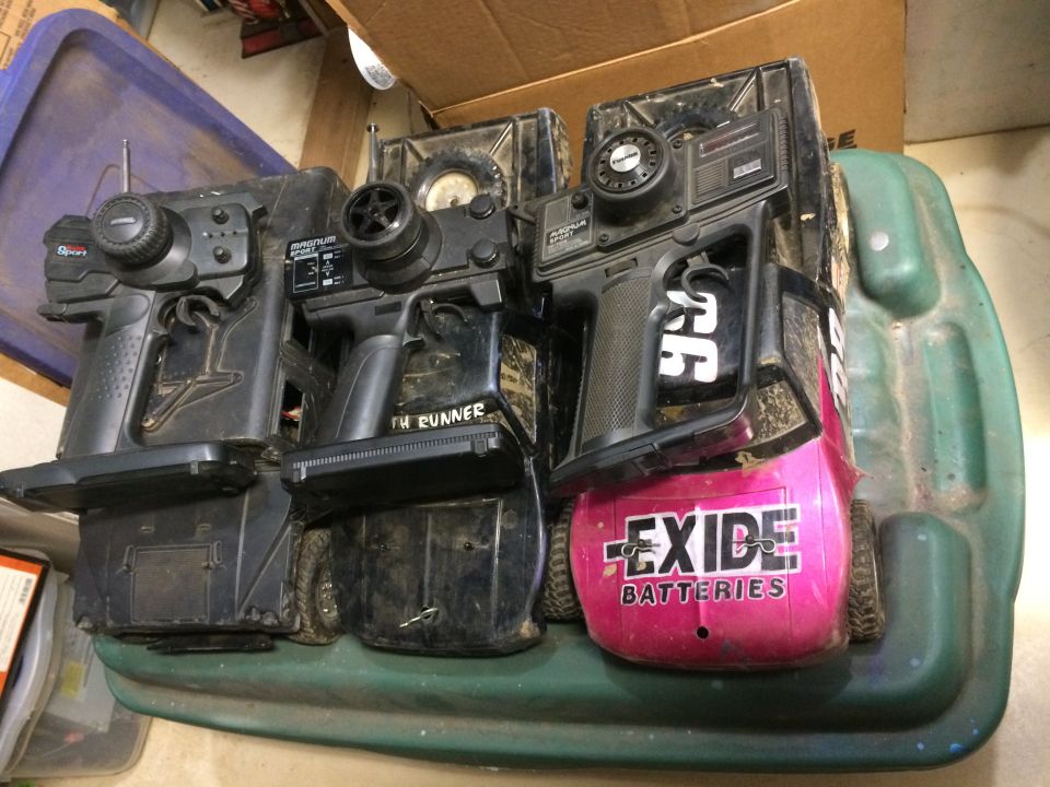 Remote control car bodies with Exide Batteries and "TH RUNNER" labels