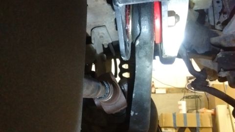1985 Ford Bronco - Underside view of vehicle driveshaft and suspension parts, potentially from a Ford Bronco.