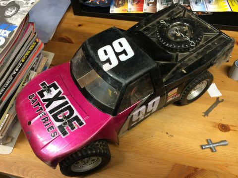 1989 Ford Bronco - This toy RC truck features "EXIDE BATTERIES" branding and racing number "99" on its body.