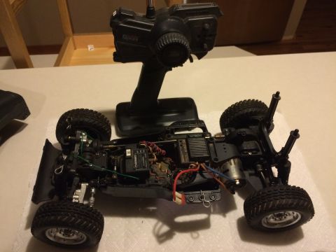 1989 Ford Bronco - This is a remote-controlled car chassis and its controller, not a 1989 Ford Bronco.