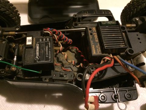 1989 Ford Bronco - Close-up view of the internal electronics and wiring of a remote control car chassis.