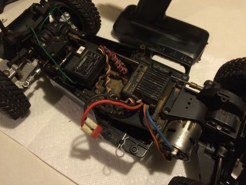 1989 Ford Bronco - Close-up view of the internal components and chassis of a remote-controlled car.
