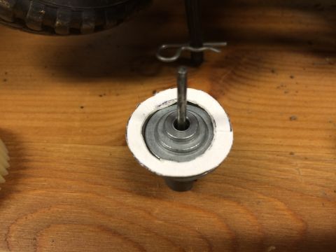 1989 Ford Bronco - A close-up view shows a metal shaft extending from a circular component with a white, felt-like ring around its top edge. The component is…