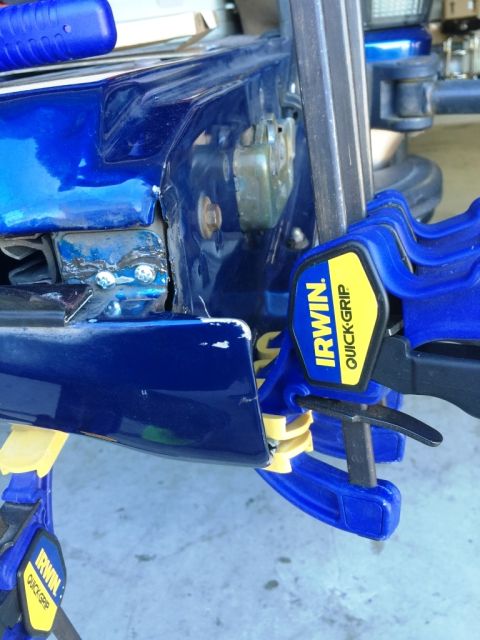 1996 Ford Bronco - Infamous talilgate split. I do not own a welder (yet) so I used some JB Weld and self tapping screws to fix temporarily.