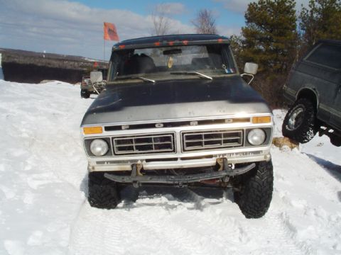 1979 Ford Bronco - This 1979 Ford F-Series truck is seen in a snowy environment with another vehicle to its right.