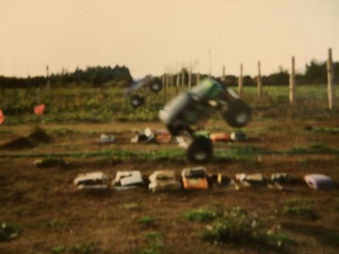 1989 Ford Bronco - A person is seen operating a vehicle in an outdoor field setting.