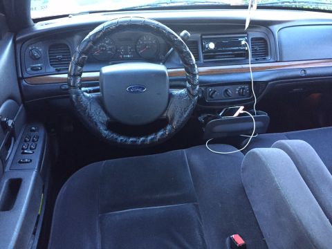 2008 Ford Crown Victoria - The interior of a 2008 Ford Crown Victoria shows the dashboard, steering wheel, and front seats.