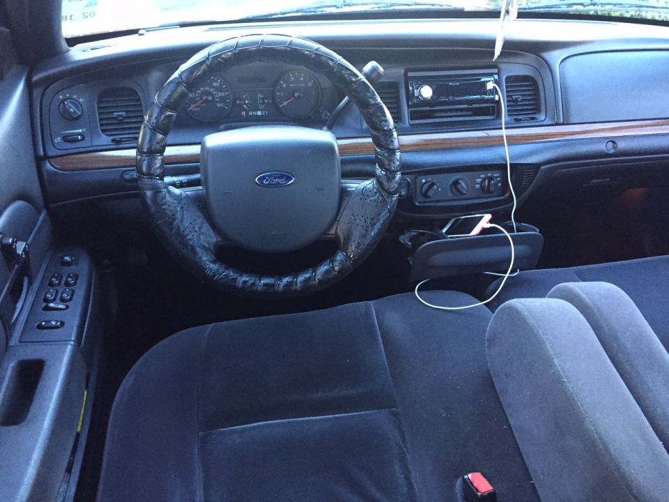 2008 Ford Crown Victoria interior with dashboard, steering wheel, and seats