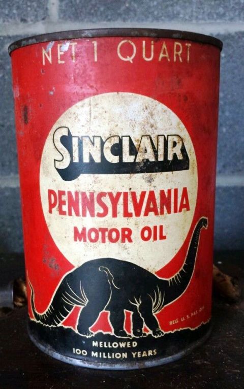 1909 Ford Model T - A vintage Sinclair Pennsylvania Motor Oil can with a dinosaur logo is shown.