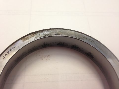 1979 Ford Bronco - A close-up view of a bearing part with "JAPAN" and "KOYO" stamped on its surface.