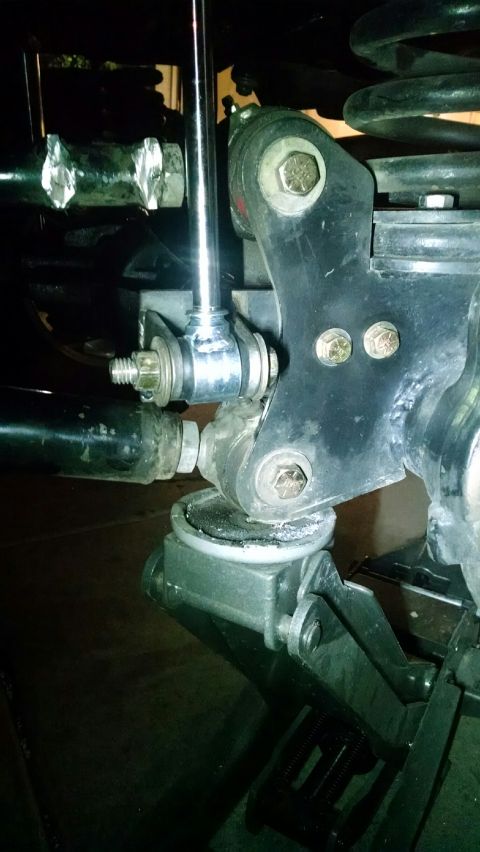 1979 Ford Bronco - Detail of a vehicle's suspension system, showing linkage and shock absorber components.