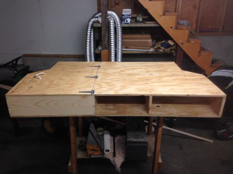 1979 Ford Bronco - A custom-built plywood storage unit is shown, with a hinged top and open cubbies.