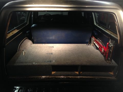 1979 Ford Bronco - Custom storage box installed in the cargo area of a 1979 Ford Bronco, with the rear seat visible.