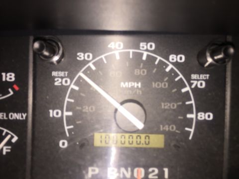 1996 Ford Bronco - The odometer shows 100,000 miles on this vehicle's dashboard, displaying the gear selector.