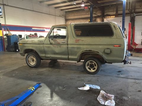 1978 Ford Bronco - This 1978 Ford Bronco is parked inside a garage, showing its side profile.