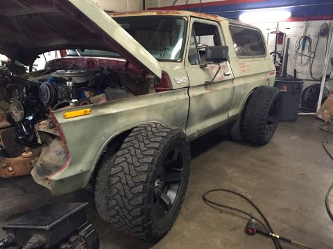 1978 Ford Bronco - This 1978 Ford Bronco is undergoing work in a garage, aftermarket wheels and tires.