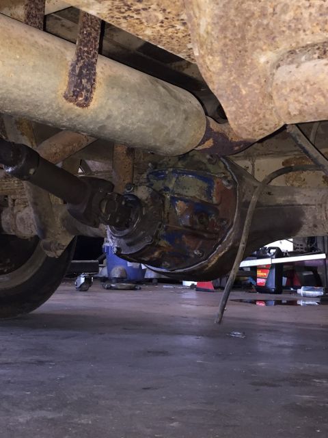 1978 Ford Bronco - Underside view of a vehicle's rear axle and differential assembly.