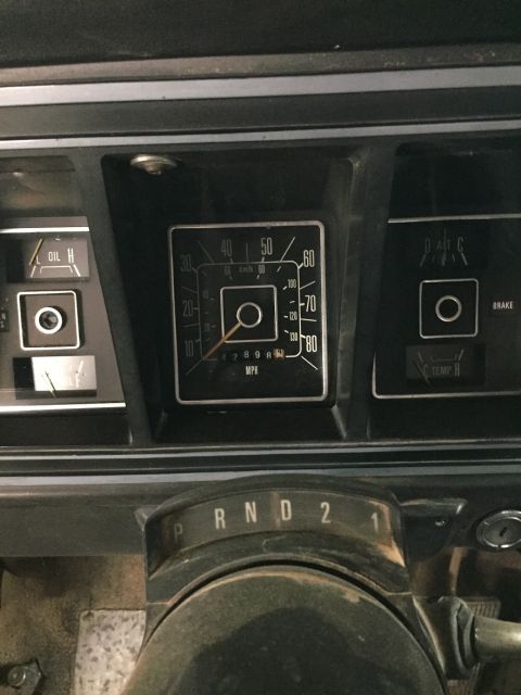 1978 Ford Bronco - The dashboard of a 1978 Ford Bronco shows its speedometer and other gauges, indicating the vehicle's interior.