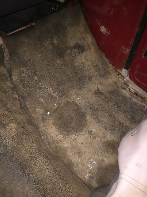 1978 Ford Bronco - The worn and stained interior floor mat shows signs of heavy use.
