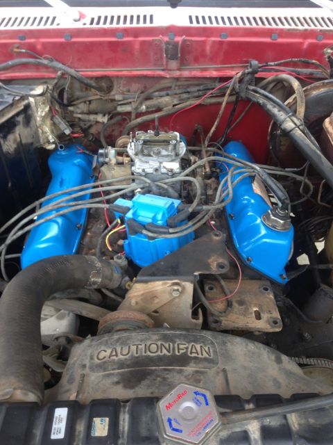 1978 Ford Bronco - Close-up view of a vehicle's engine bay, showing various components and wiring.