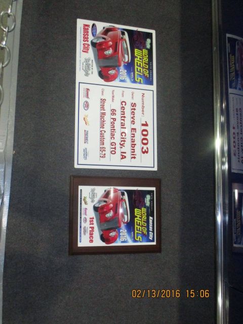 2004 Ford Crown Victoria - Documents display information about a 1966 Pontiac GTO from a car show.