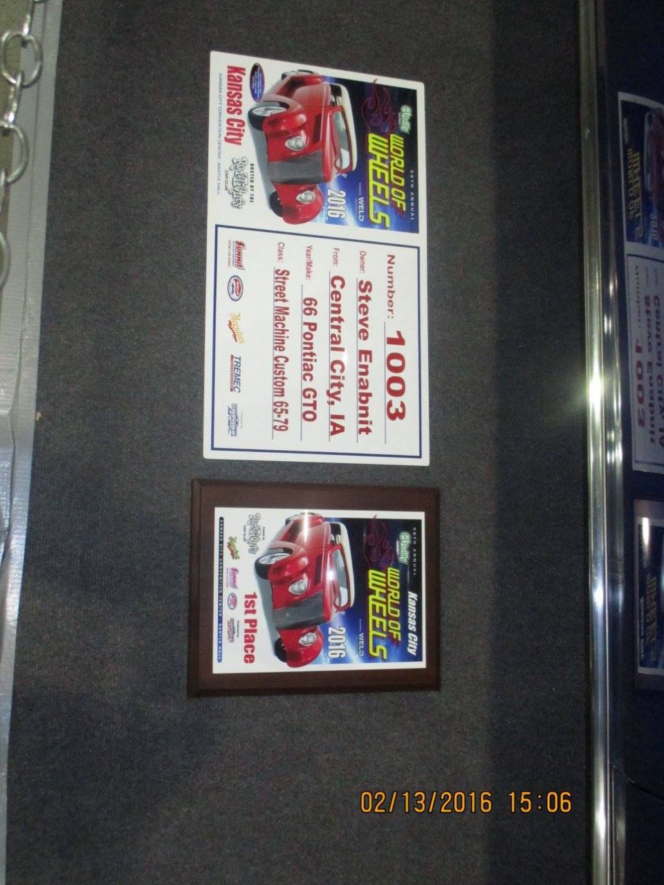 Two framed documents with car images and text about a 1966 Pontiac GTO