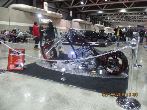 2004 Ford Crown Victoria - Custom chopper motorcycle displayed at an indoor event, with a date stamp of 02/13/2016.