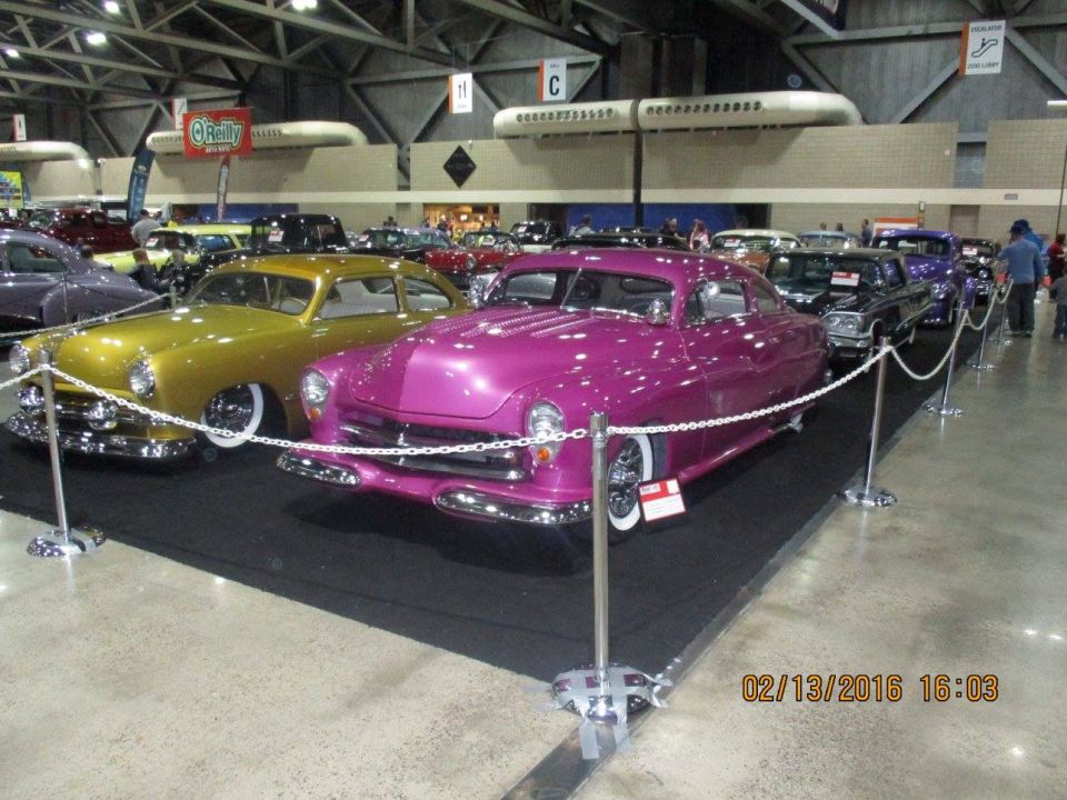 Pink custom hot rod with whitewall tires and chrome accents