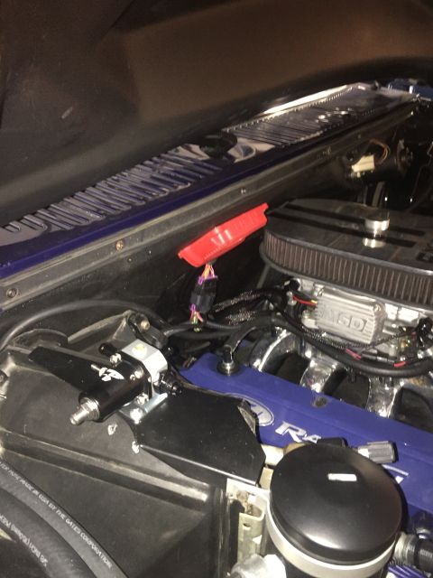 1982 Ford Bronco - Aftermarket fuel pressure regulator and air intake installed in the engine bay.