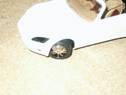 1998 Mercury Sable - Detail of a model car's front wheel and fender assembly.