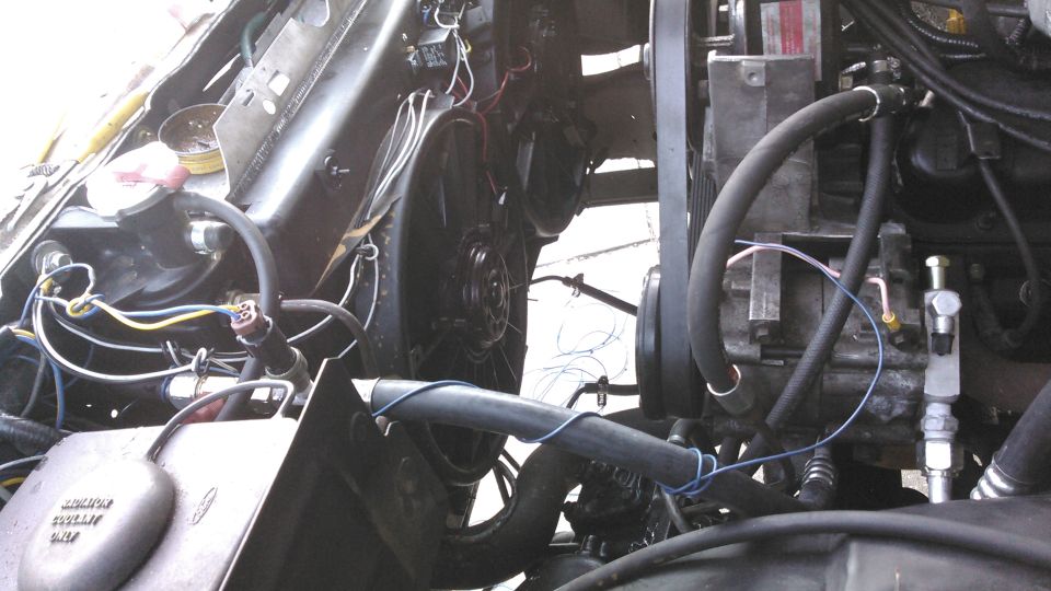 all new A/C setup. new condenser, evaporator, accumulator, custom lines. cycling switch and high pressure snesor are wired to a a relay which turns on and off the clutch and an electric fan for the condenser