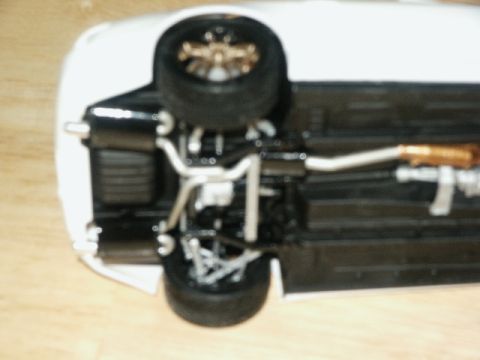 1998 Mercury Sable - Underside of a model car, displaying its exhaust and suspension components.