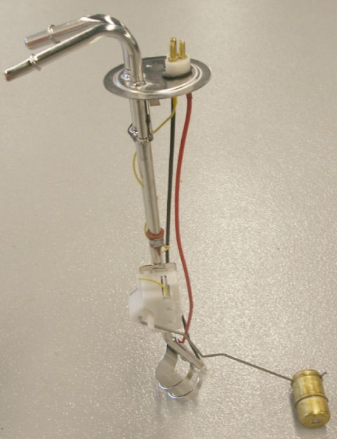 1982 Ford Bronco - A fuel sending unit with electrical connectors and a float arm is shown against a neutral background.