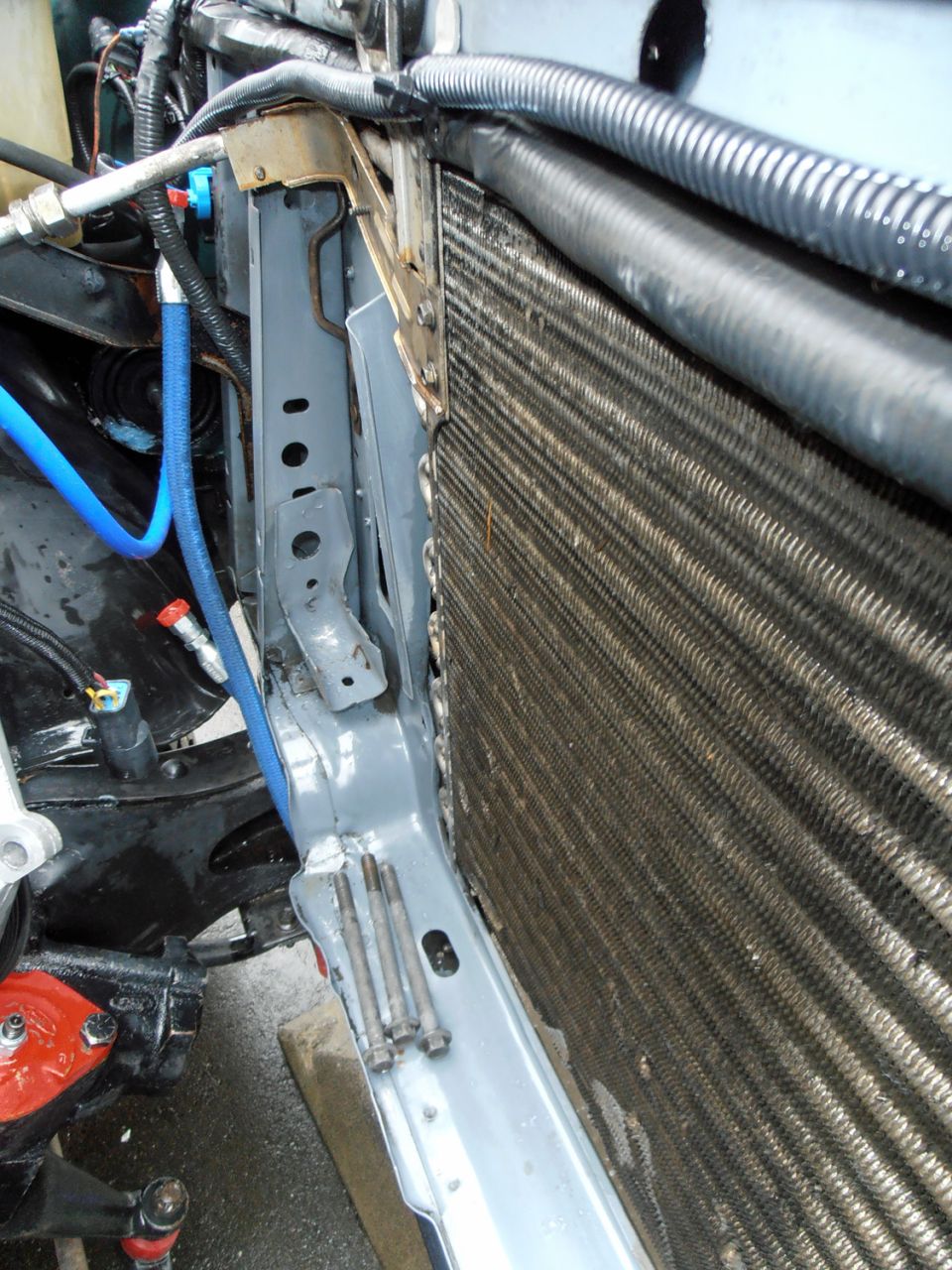 Radiator and blue hose in engine bay