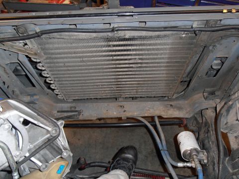 1990 Ford Bronco - Close-up view of a vehicle's radiator and surrounding engine bay components.