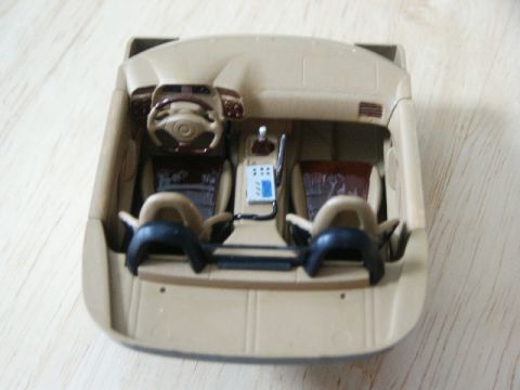 1998 Mercury Sable - A close-up view of a toy car's interior, tan and brown elements.