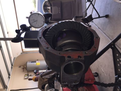 1991 Ford Bronco - Measuring differential backlash with a dial indicator on a workbench.