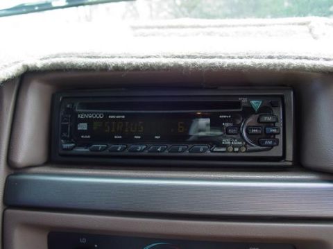 1995 Ford Bronco - The dashboard features a Kenwood stereo system with a Sirius radio display.