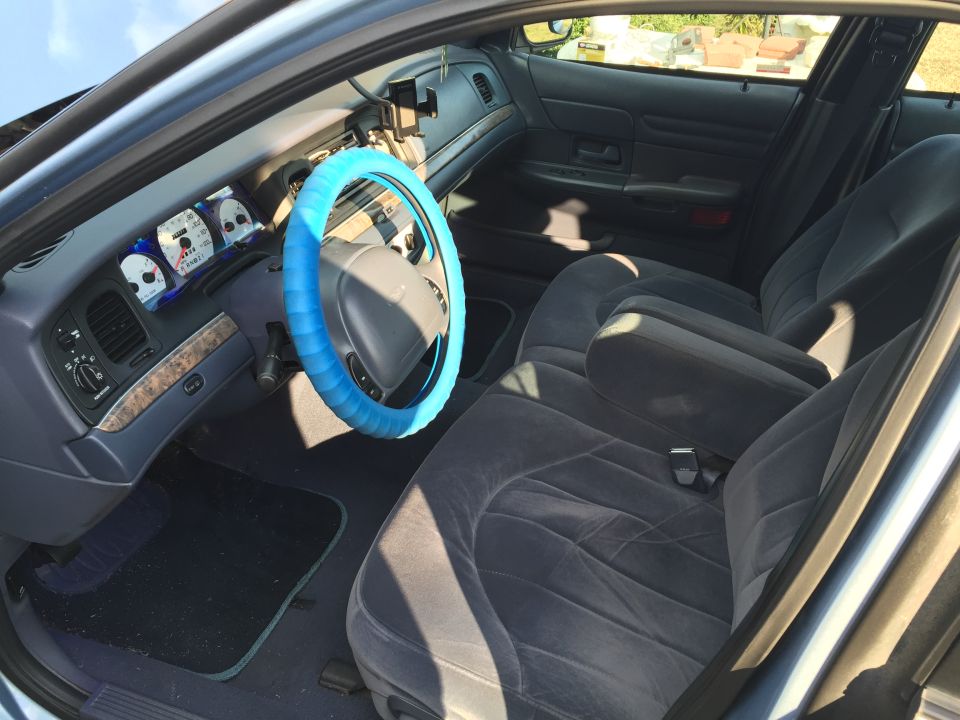 1994 Ford Crown Victoria interior with blue steering wheel cover and grey seats