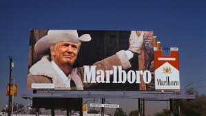 1995 Mercury Grand Marquis - A billboard displays a Marlboro advertisement a man dressed as a cowboy, promoting the cigarette brand.