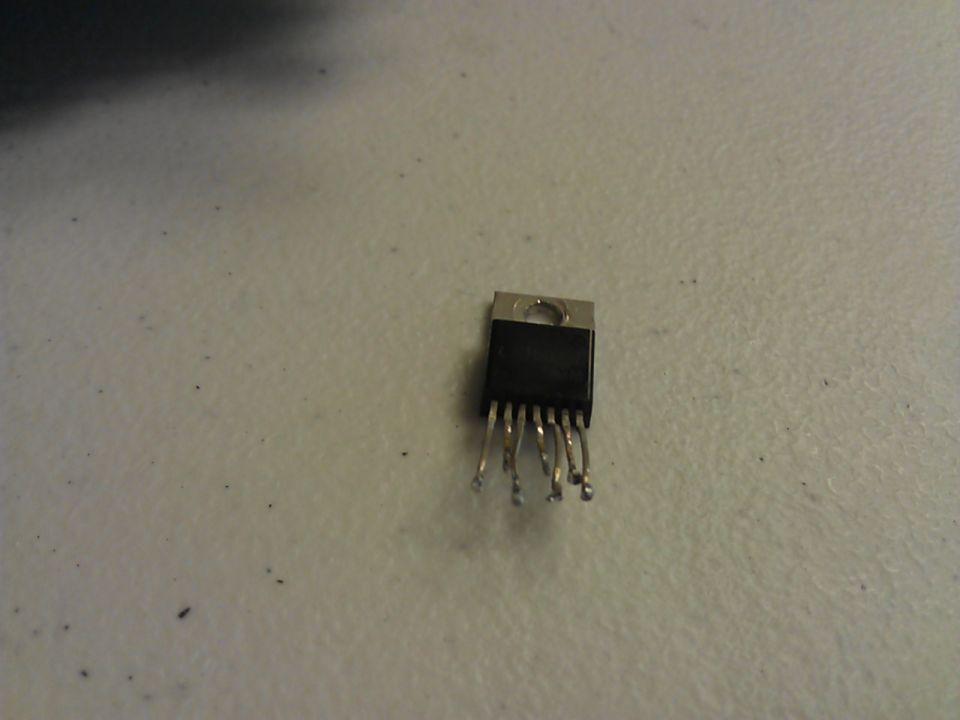 Black integrated circuit chip with metal pins