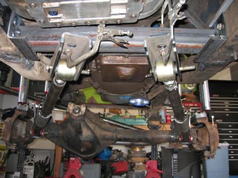 1981 Ford Bronco - Underside view of a 1981 Ford Bronco's rear axle and suspension system, showing custom fabrication with adjustable control arms and beefy m…