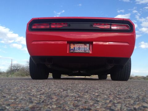 2010 Dodge Challenger - Rear view of a red Dodge Challenger with dual exhaust pipes and an Arizona license plate.