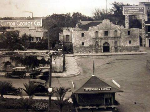 1909 Ford Model T - A street scene in front of the historic Alamo mission, with several early 20th-century automobiles visible.