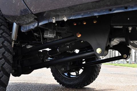 1981 Ford Bronco - Undercarriage view shows steering linkage and suspension components.
