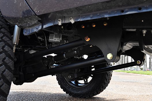 Close-up of heavy-duty suspension and steering parts on a vehicle