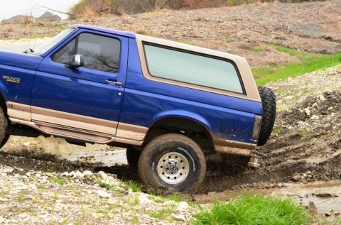 1996 Ford Bronco - This 1996 Ford Bronco navigates a muddy off-road trail, its capabilities.